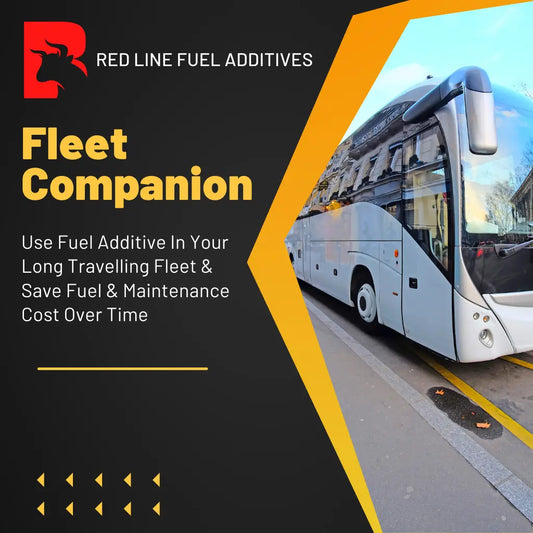 A red bus with white lettering is parked on the side of a road next to a beige building. The text on the bus reads "RED LINE FUEL ADDITIVES Fleet Companion. Use Fuel Additive In Your Long Travelling Fleet & Save Fuel & Maintenance Cost Over Time.
